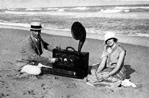 Armstrong with his wife and a portable radio he built for her (1923)