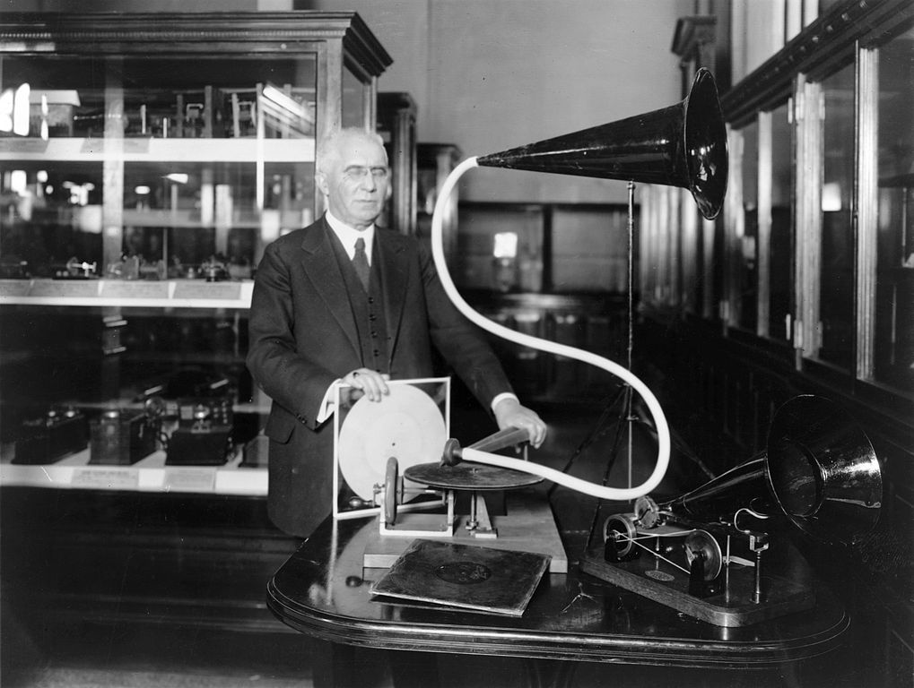 Berliner with a model of his first phonograph