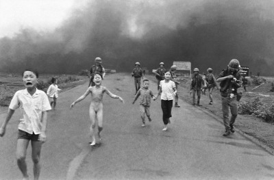 Kim Phúc, center left, running down a road naked near Trang Bang after a South Vietnamese Air Force napalm attack