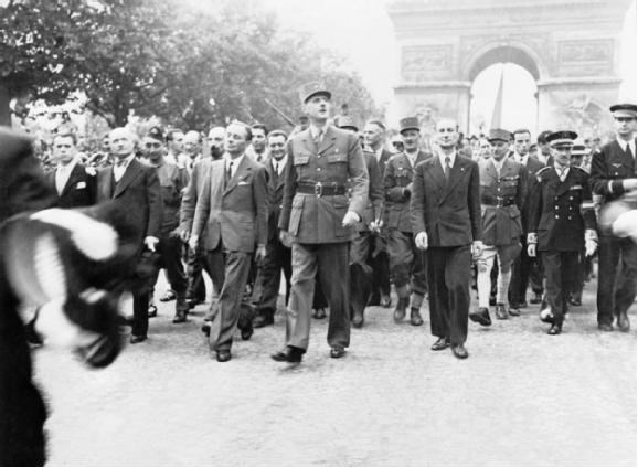 General Charles de Gaulle and his entourage in front of the Arc de Triumphe
