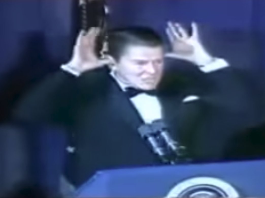Ronald Reagan Sticks His Thumbs in His Ears