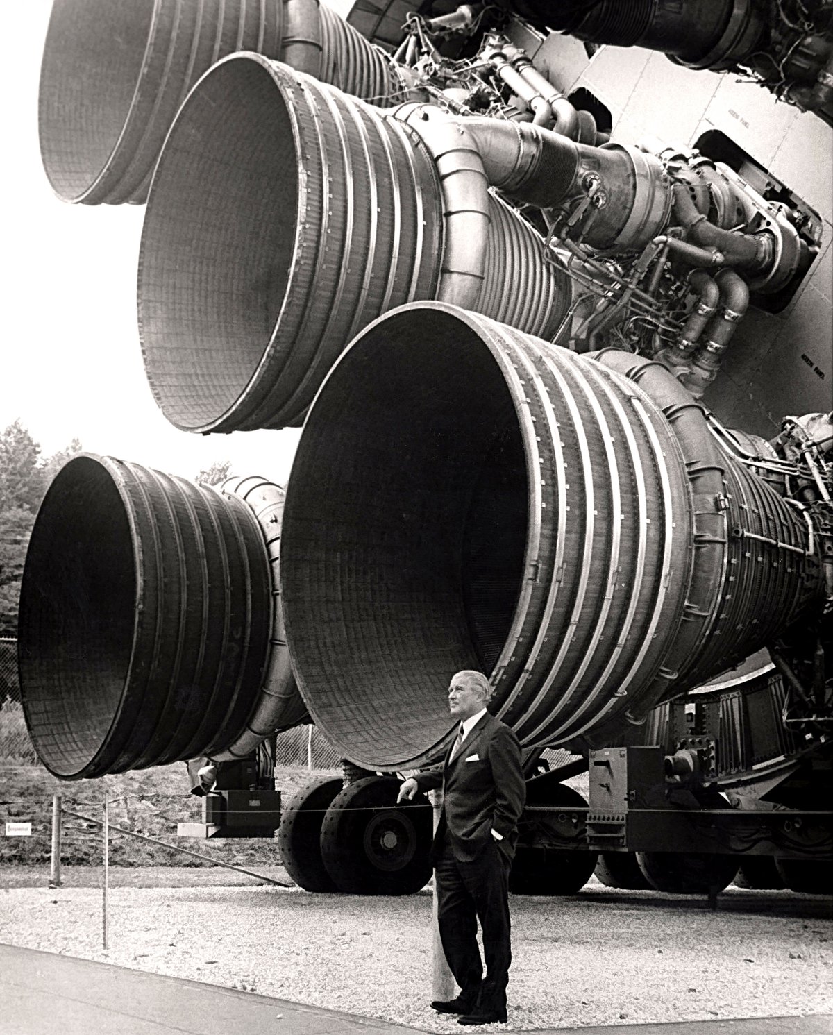 Dr. von Braun standing by F-1 Engines