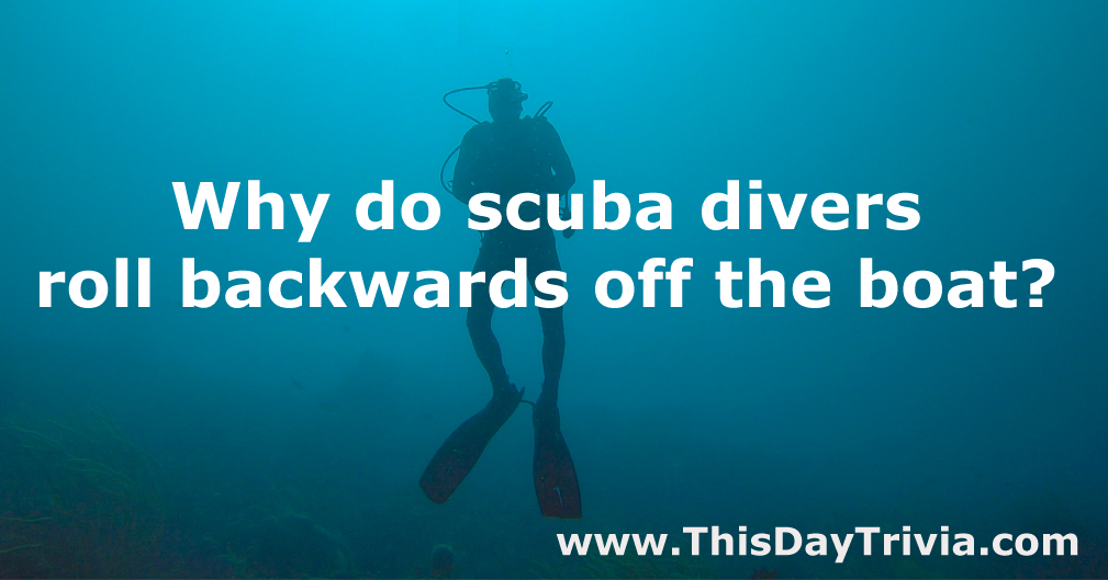 Why do scuba divers roll backwards off the boat?