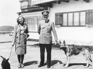 Braun and Hitler walking their dogs