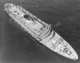 Andrea Doria listing after the impact. The starboard lifeboats have been launched, while the portside lifeboats are still attached