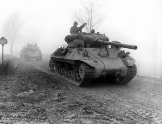 U.S. tank destroyers moving forward during heavy fog