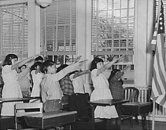 American children reciting the Pledge of Allegiance with the Bellamy Salute in 1941