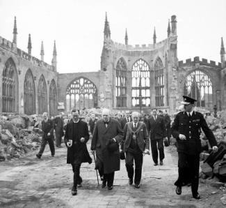Winston Churchill walking through the ruins of Coventry Cathedral