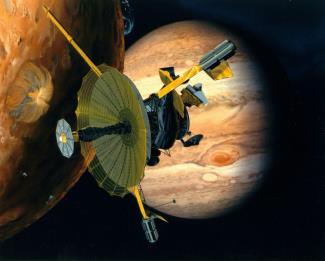 Artist's rendering of Galileo at Io with Jupiter in the background