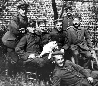 Hitler (seated far right) with his dog Fuchsl and war comrades