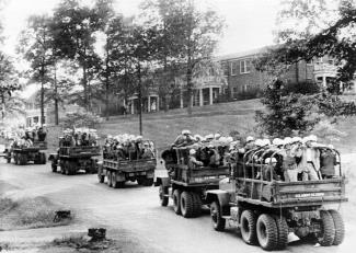 U.S. Army trucks roll across the University of Mississippi campus in the wake of the riots when Meredith entered