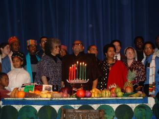 Karenga (center) celebrating Kwanzaa