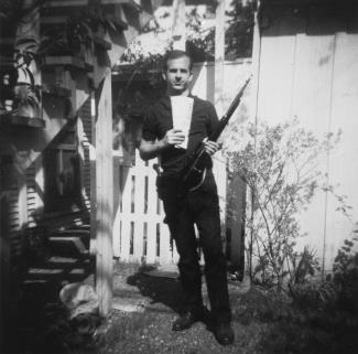 Oswald posing with a rifle a few weeks before the shooting