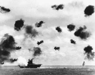 USS Yorktown is hit on the port side by a Japanese aerial torpedo