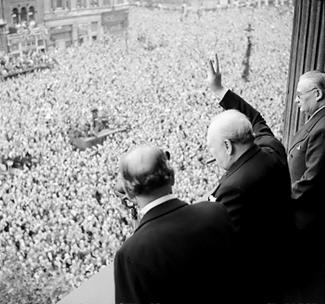 Churchill waves to crowds in celebration of Germany's surrender
