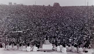 Swami Satchidananda giving the opening speech of Woodstock