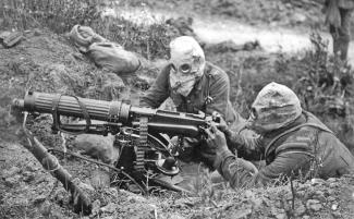 WWI Gun Crew with Gas Masks, photo by John Warwick Brooke