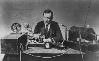 Marconi demonstrating equipment for his first long-distance radio transmissions